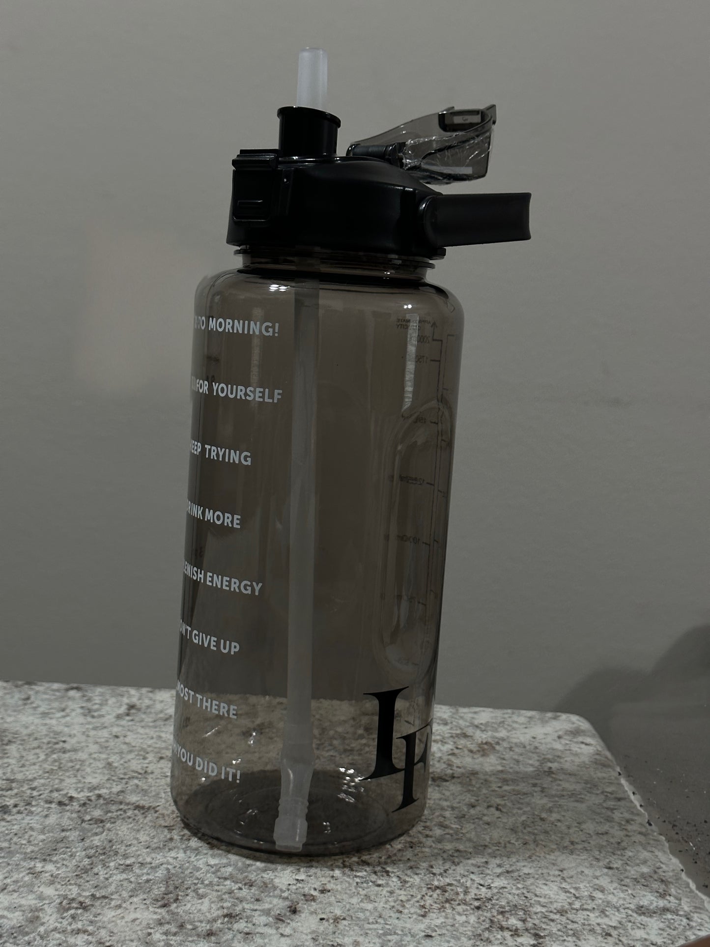 Lulufit motivational water bottle 64oz.